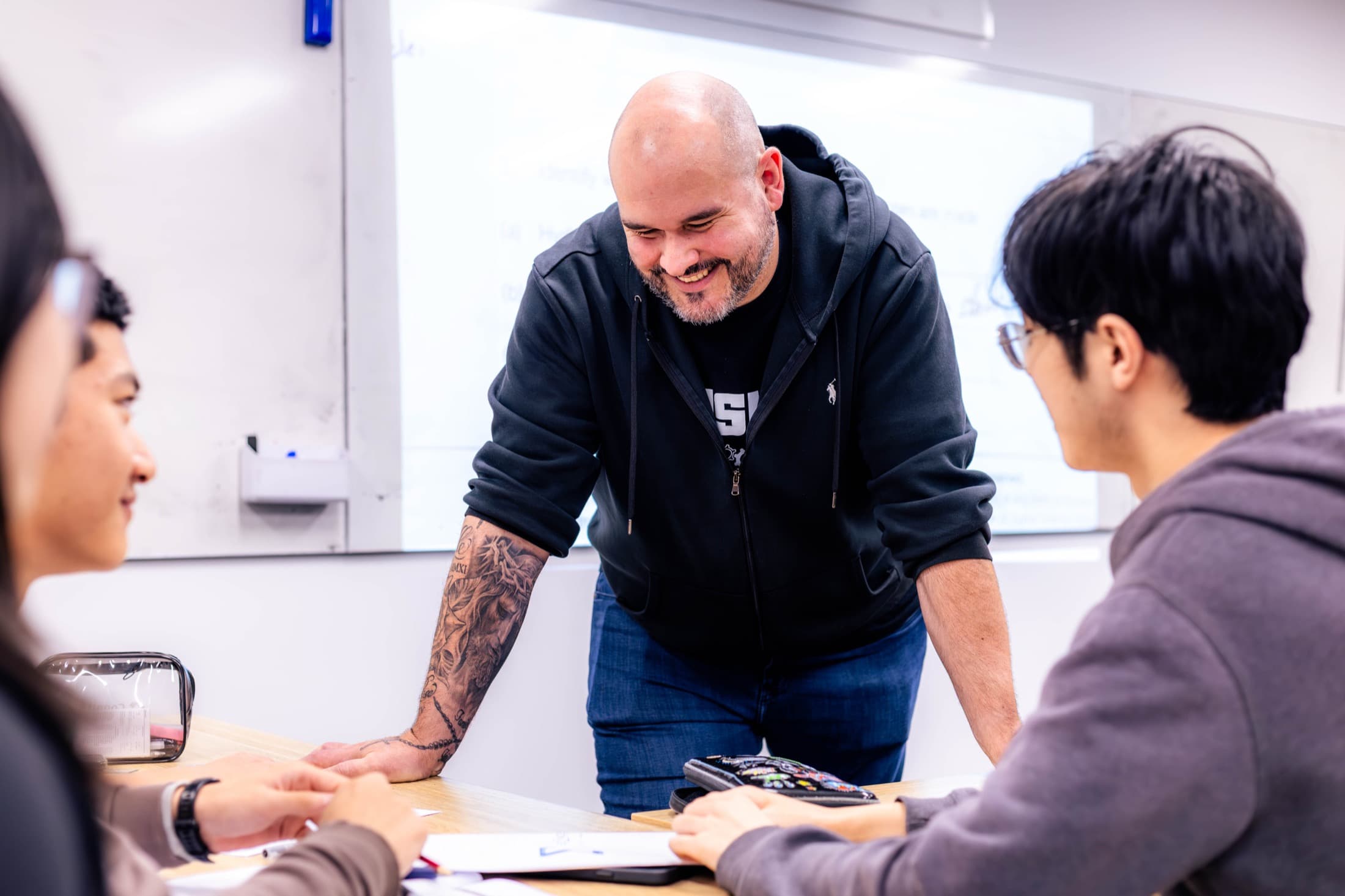 A Sigma Science teacher working one-on-one with a student